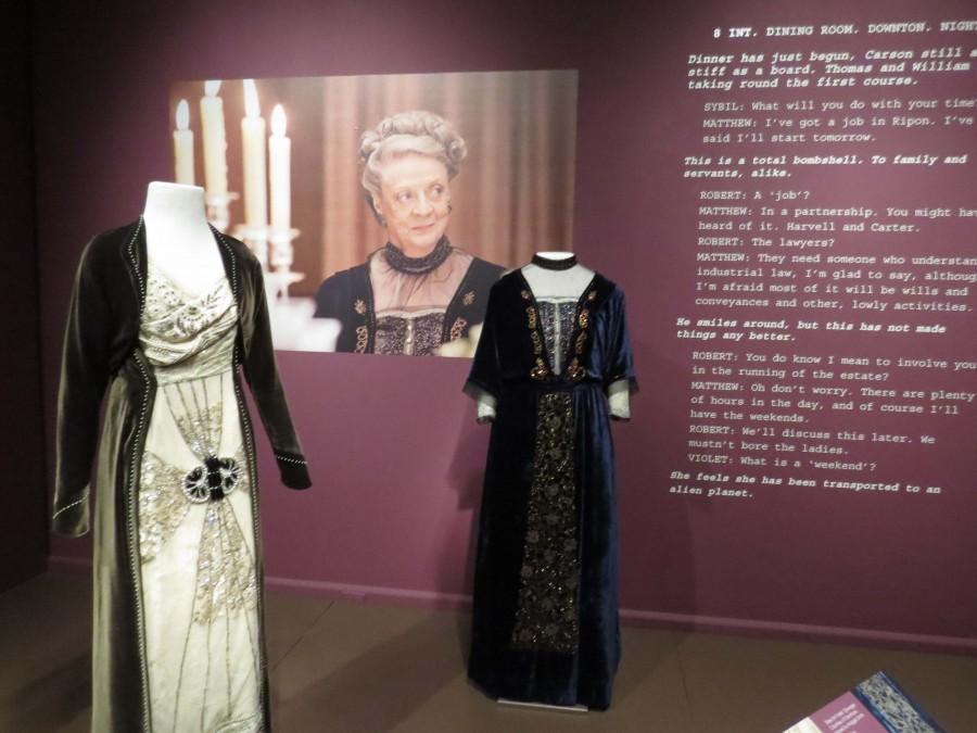 Costumes from Downton Abbey showcased at Winterthur Museum, Garden, and Library. The dark blue dress (right) was worn by the Dowager Countess of Grantham, played by Dame Maggie Smith. 