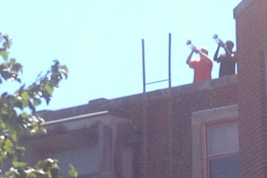 Two trumpeters concluded the ceremony by playing Taps from the school roof. 