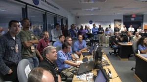 Class of 1988 member Jeff Herath (center, wearing a black shirt) watches Curiosity's landing during the