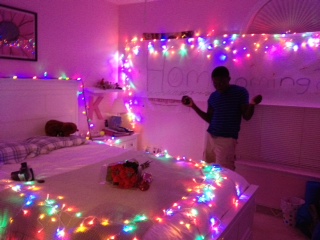 Sophomore Moses Bomah asks sophomore Kimberly Pitt to Homecoming by decorating her bedroom and having flowers at the ready. 