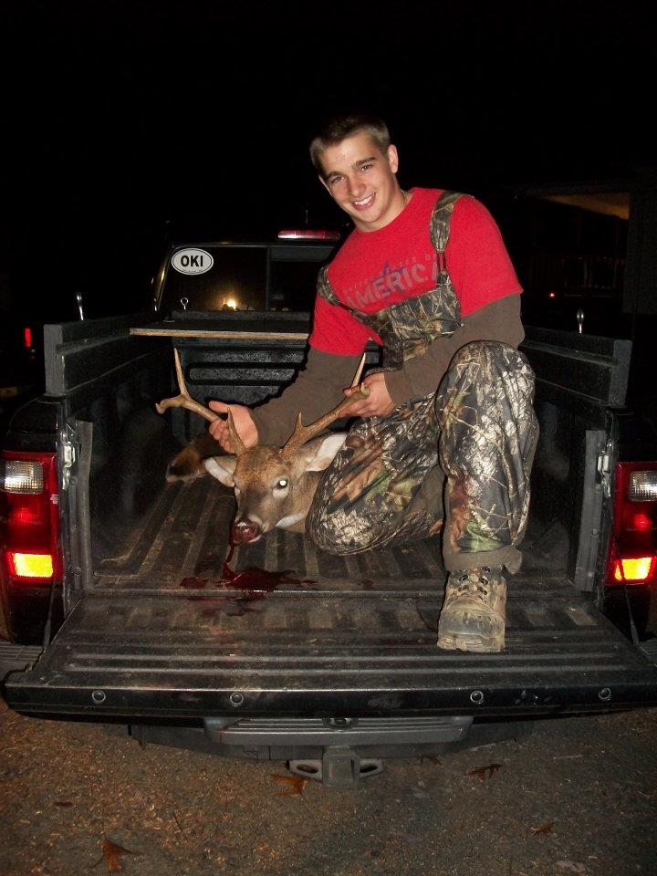 Junior Drake Bryant proudly holds up his fresh kill. Bryant has been hunting since the age of 5. 