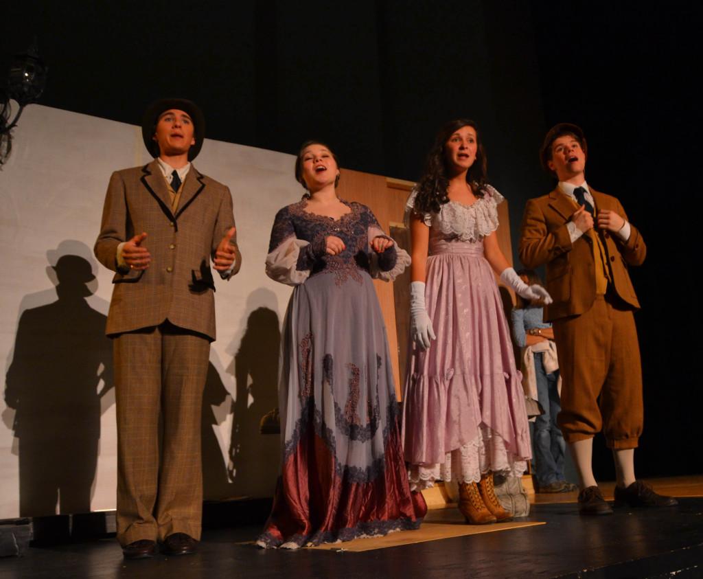 The cast rehearses the song Elegance for the musical, showing May 2-5. Sophomore Aaron Hoffman and seniors Christina Ramsey, Anna Goodrich and Ben Merrel have been preparing since February. 