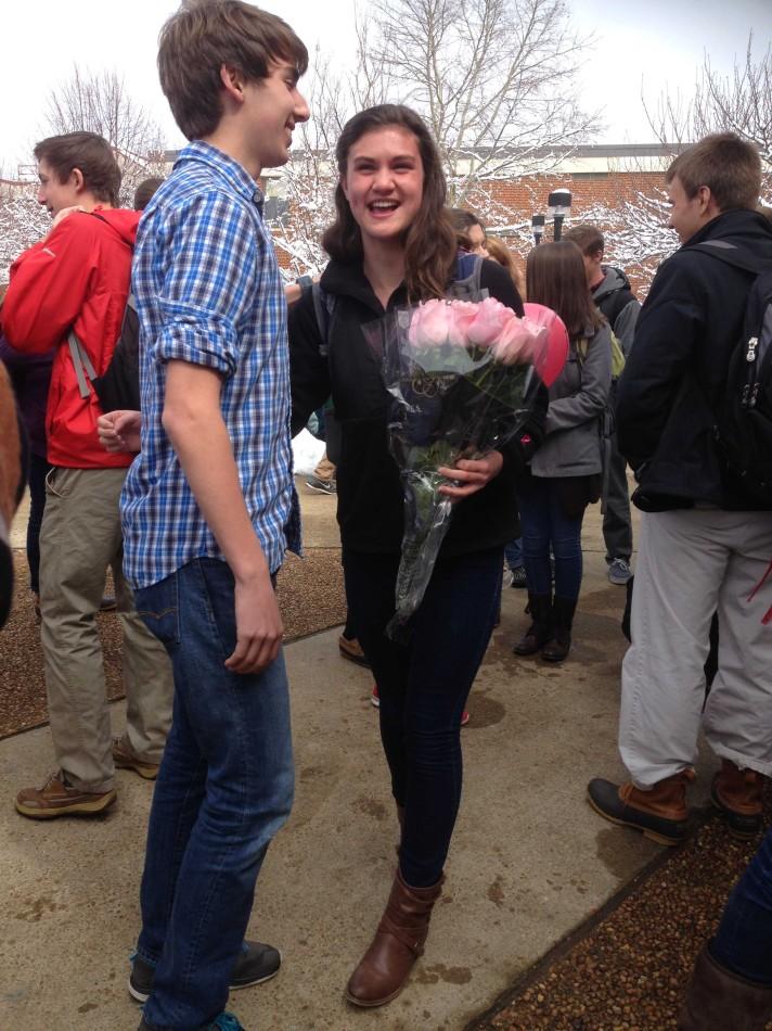 Junior Zach Gentry asks junior Caroline Keller to Prom with flowers and a failed attempt to play Sweet Caroline through a pair of speakers. She accepts with a smile regardless of the technical difficulties. 