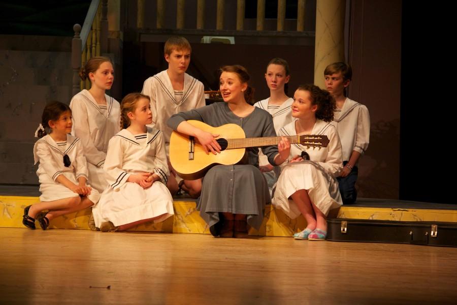 Junior Olivia Whicheloe, playing Maria Rainer, sings “Do-Re-Mi” with the von Trapp children, played by (L-R) Anya Rothman, sophormore Sara Madison Gildersleeve-Price, Sarah Beiter, freshman Doug Kulow, junior Stephanie Owen, Landon Duval and freshman Annalise Livingston. “I like ‘Do-Rei-Mi.’ It’s her first real moment alone with the kids,” Whicheloe said. “It’s her way of saying ‘hi’ and ‘this is who I am’ and I’m not going to change who I am. I want to see what I can do to change you to make you happier.”