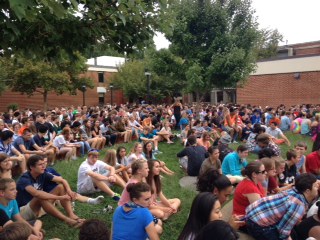 Students crowd the breezeway to hear the tribute to 9/11. 