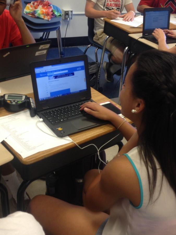 Freshman Kayla Mann uses her laptop to make a training brochure in her Sports Medicine class. 
