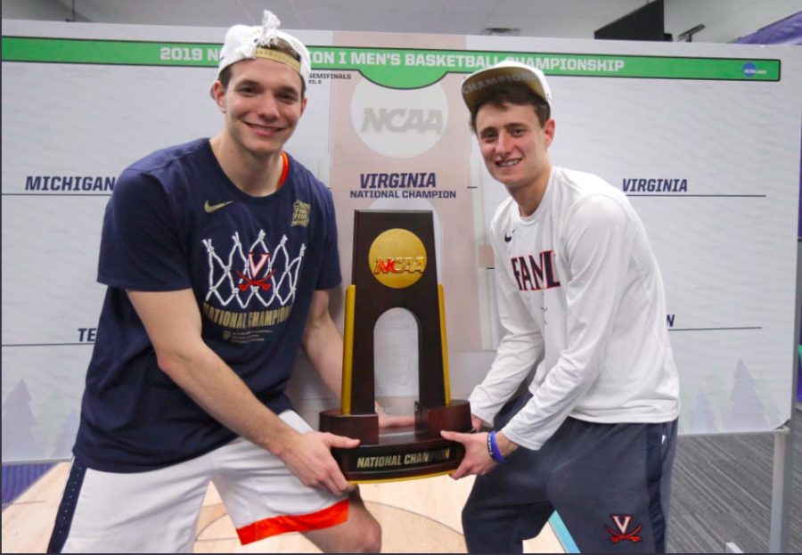 Katstra and Kersey hoist the NCAA Championship Trophy. UVA beat Texas Tech 85-77 in overtime. 