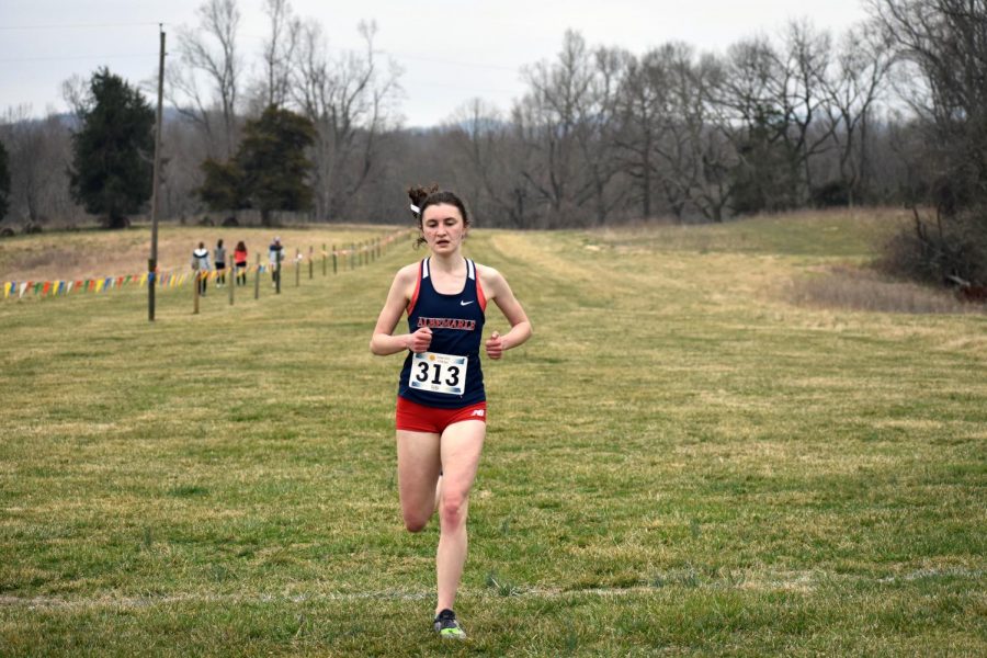 Senior Arianna DeBoer takes first place at the cross country meet on March 17 at Panorama Farms. DeBoer would go on to win the State cross country title and lead her team to its first state championship. 