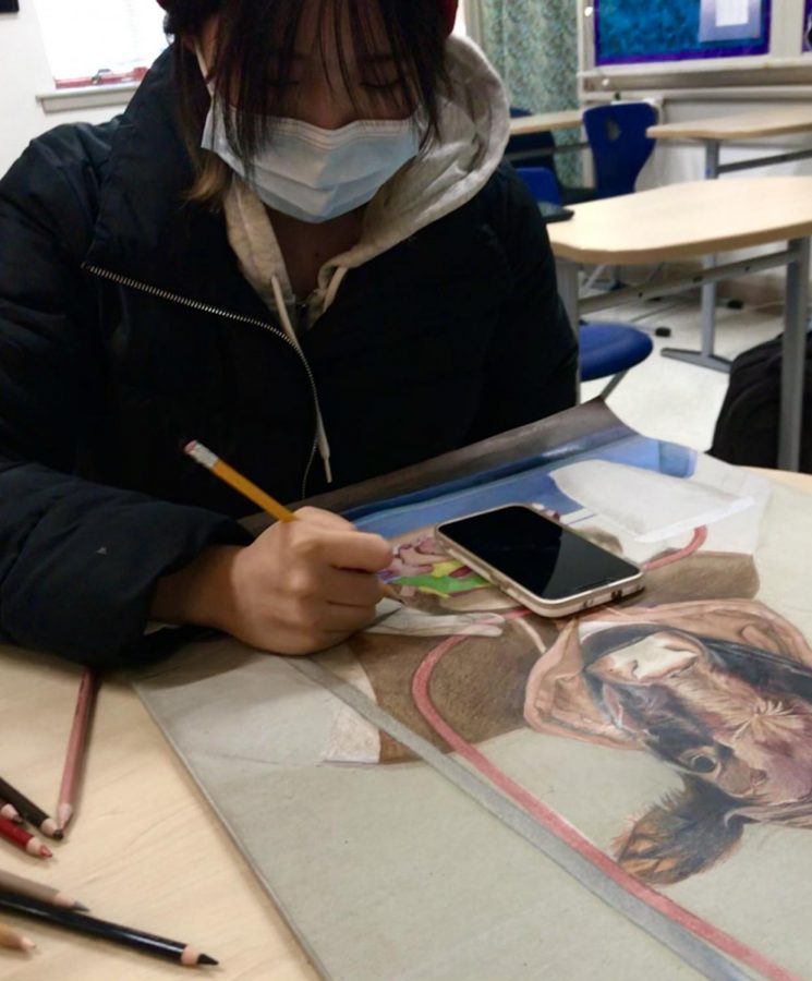 Helen Hou works on her art piece for the Scholastic and Celebrating Art Fall competitions.