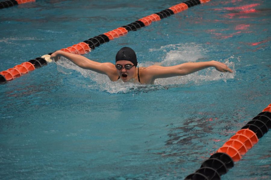 Sophomore Lorelei Paige Henry catches a breath during the girls 100 butterfly. Heny finished second in Heat 1 with a time of 40.64 seconds. 