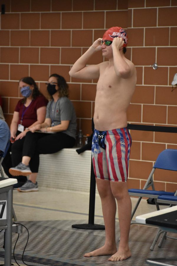 Junior Graham Devito prepares for his 500 freestyle race. Devito placed third overall with a time of 5 minutes 8.81 seconds.