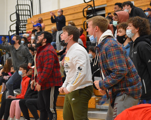 Rowdy Albemarle fans cheer for the Patriots as they steal the ball from Western and sprint down the court.