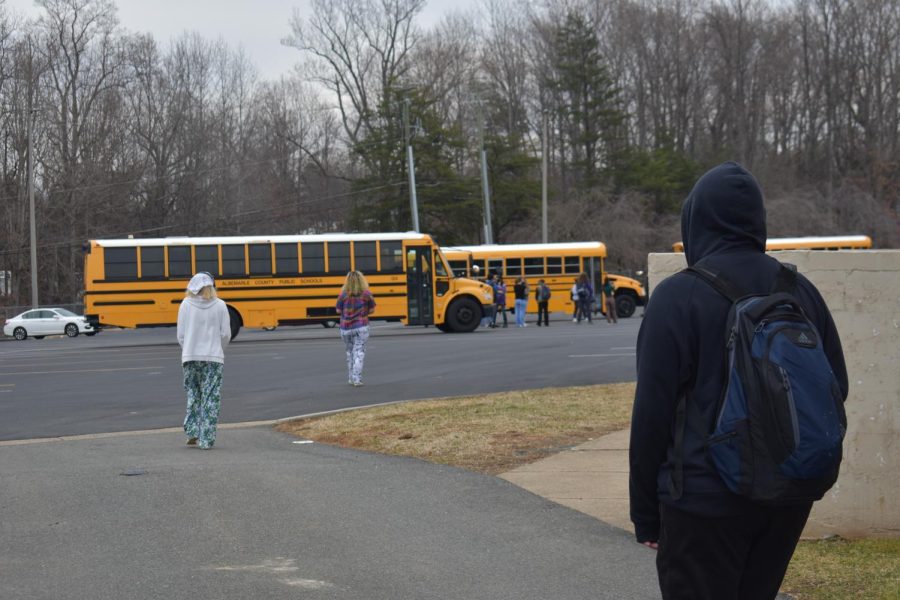 Albemarle students leave the school building at 9:30 am to join a walkout in the bus loop.