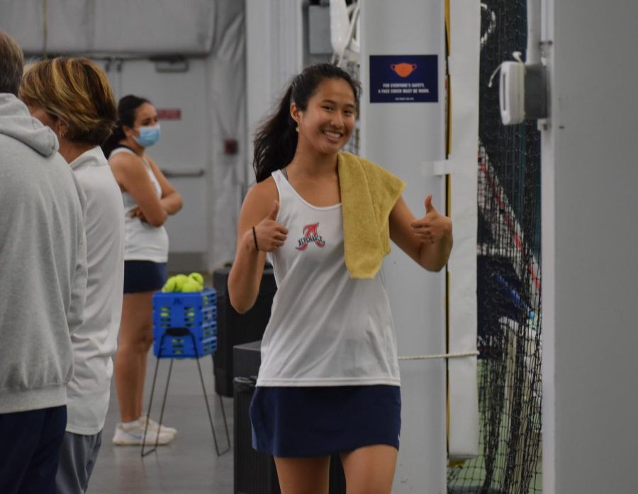 Junior Amy Wang comes of the court smiling after winning both her sets 6-0 against Riverbends fourth seed.
