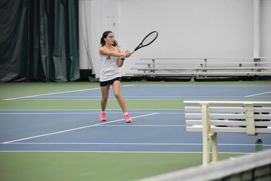 Senior Emma Paitrick smacks the ball over the net during her second set. She later won the set 6-3 to win the match over Riverbends second seed player.