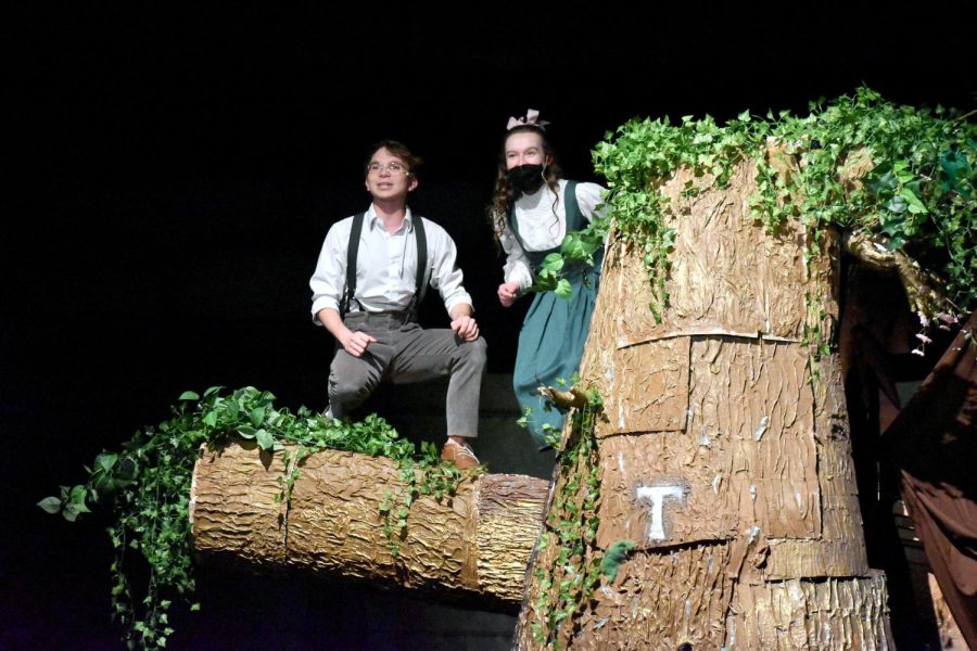 Jesse Tuck (senior Ezra Smith) and Winnie Foster (senior Hope King) sing Top of the World from the tree above the magical spring.