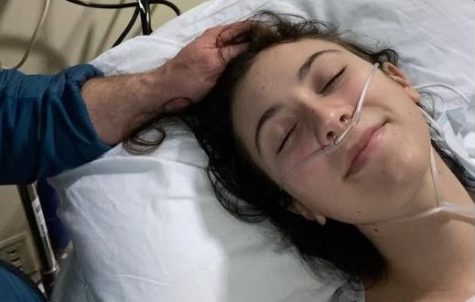 Senior Ginny Bruno rests in her UVA hospital bed before surgery on her brain tumor. Bruno discovered in January that she had a tumor that had been growing for 10 years.