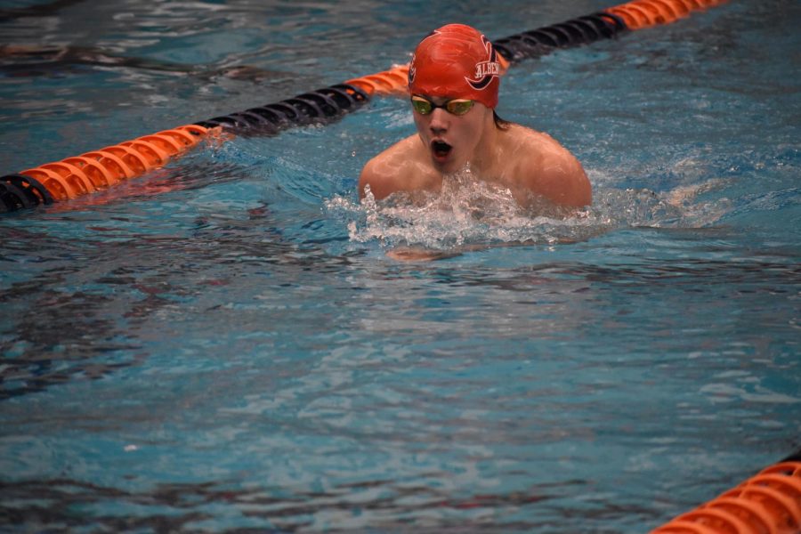 Junior Lance Elmore comes up for air while swimming breaststroke in the boys 200 IM at the Jan. 10 Ben Hair Meet. He and teammate junior Sawyer Strickler placed second and third respectively in their heat.