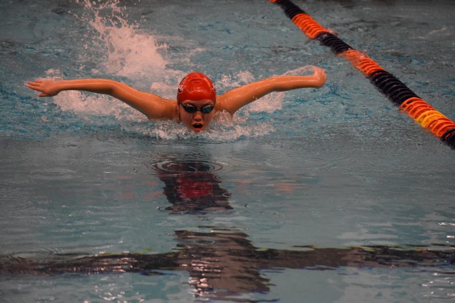 Freshman Amy Wang comes up for air in the girls 100 butterfly.