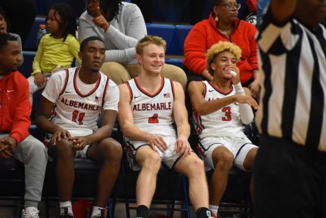 Seniors Lamari Parler, Carter Wesson, and Christian Humes enjoy some rest after creating a significant lead in the first half of the game.
