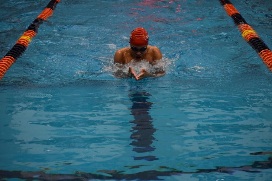 Freshman Bradley Sawyer comes up for air while competing in 100 breaststroke heat six at the Jan. 10 Ben Hair Meet. He finished fourth in his heat.