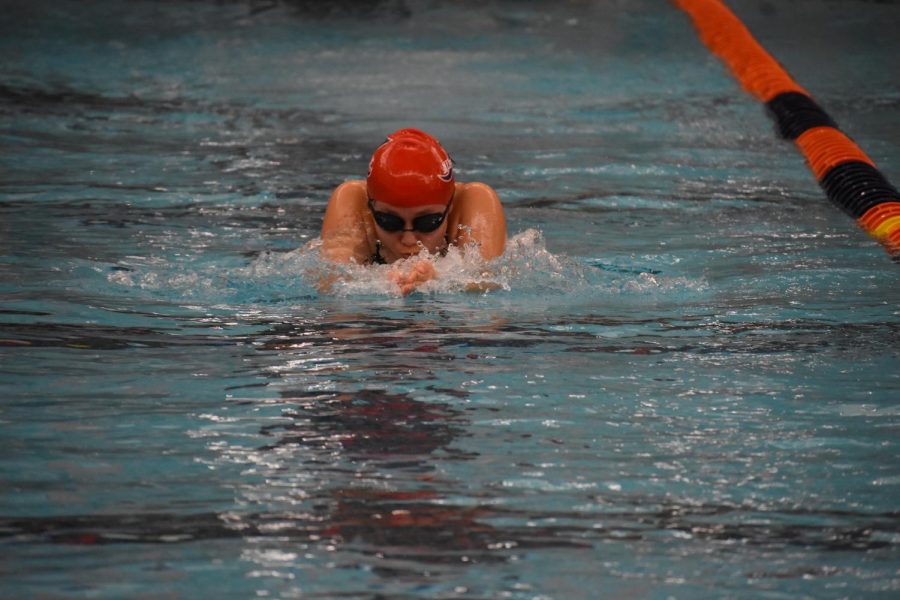 Sophomore Suah Kwon thrusts forwards during the breaststroke leg of the girls 200 medley relay B at the Jan. 10 Ben Hair Meet. 