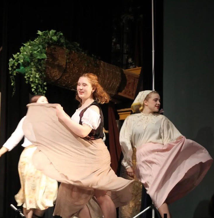 Liz Stone performs in ensemble for the fall play, Tuck Everlasting.