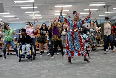 Lillie Williams of the African dance group Chihamba leads a group of students and teachers in a performance during second lunch on Feb. 10. The dance and drum group is one of many opportunities and activities in AHS Black History Month celebration. 