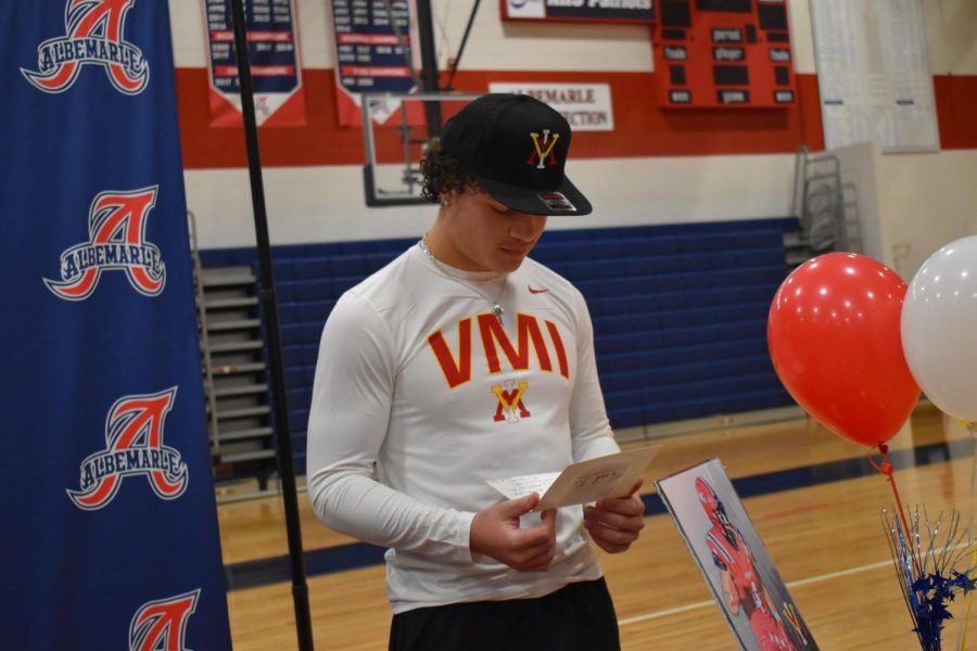 Senior Isaiah Grevious reads the Letter of Intent on Signing Day. He will play football for VMI.