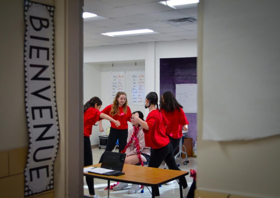 A peek through the door: Dance Team performs for a student in French class.