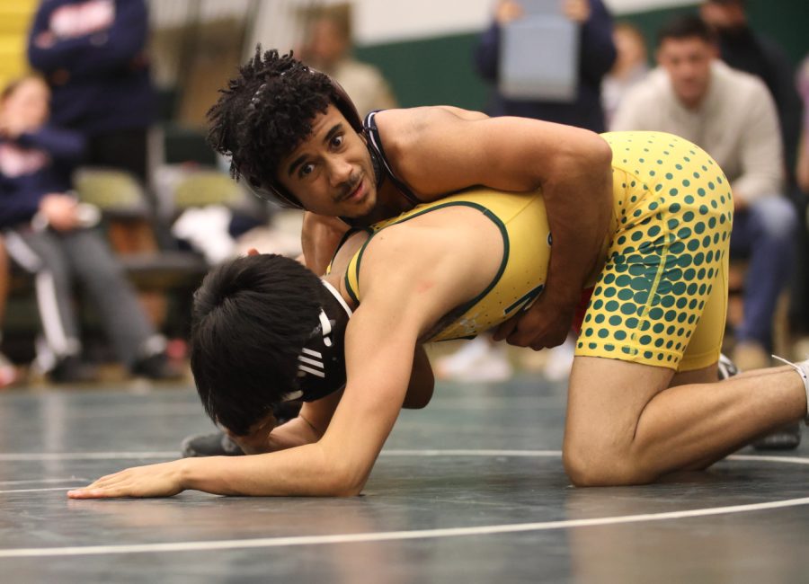 Junior Kawika Keys holds his opponent in place before starting the wrestling round