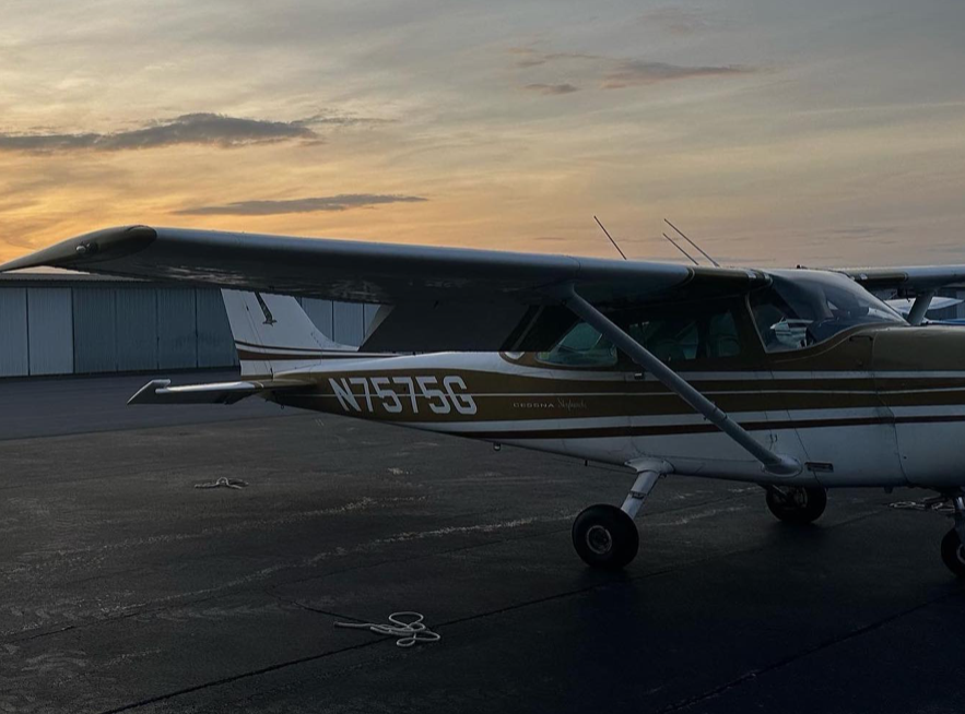 A Cessna, one of the planes Davis and DeVito often fly, sits on the runway at sunrise.