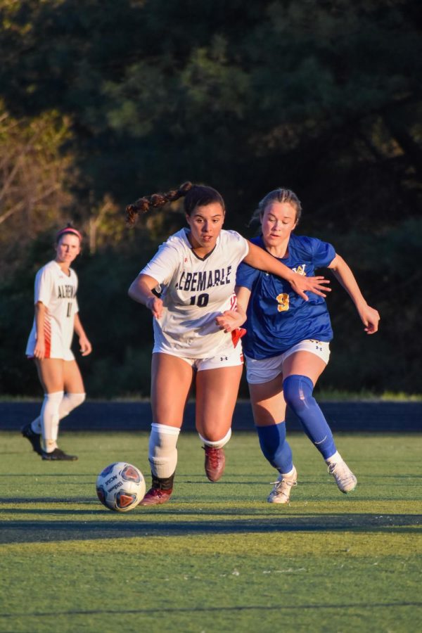Sprinting ahead of WAHS player, sophomore Lana Ortiz chases the ball in the midfield. 