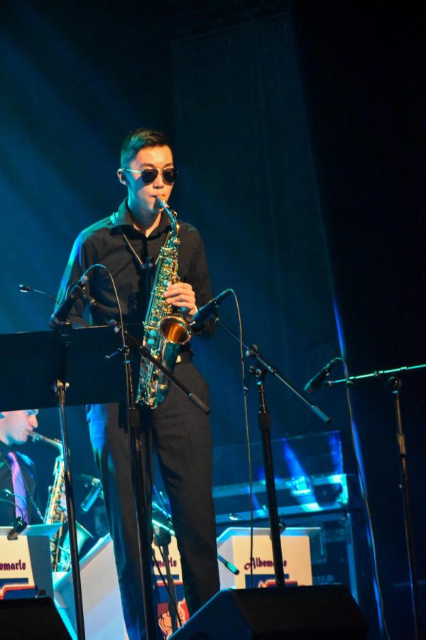 Sophomore Eric Chen performs Aim High by Fred Sturm on the saxophone, wearing sunglasses he put on before the solo. 