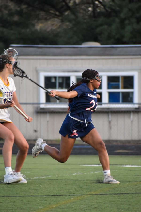 Sophomore defender Madison Vandross lunges as she reaches the AHS 8 meter, attempting to slow down a Western fast break. 
