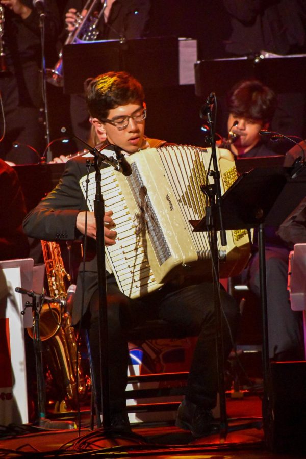 Squeezing an accordion, Senior David Barredo solos during the song Tonight We Tango by Rick Hirsch.