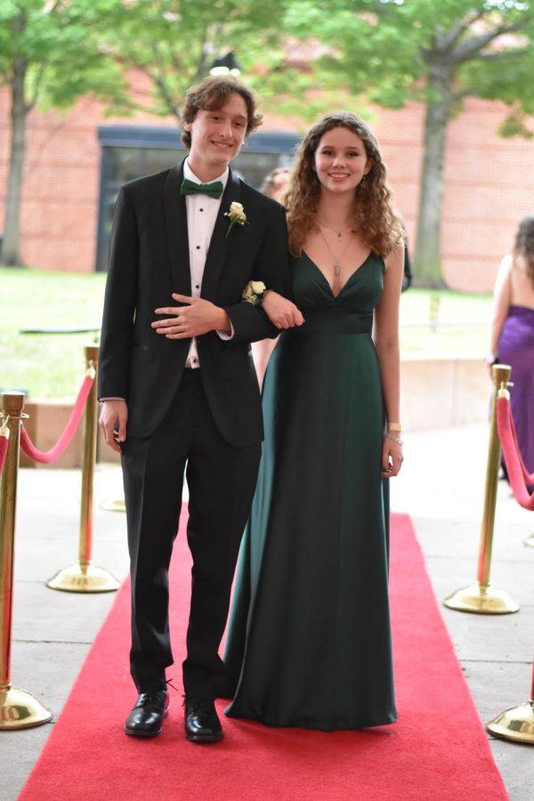 Juniors Alex Fischer and Elena Schroeder sport traditional prom ensembles.