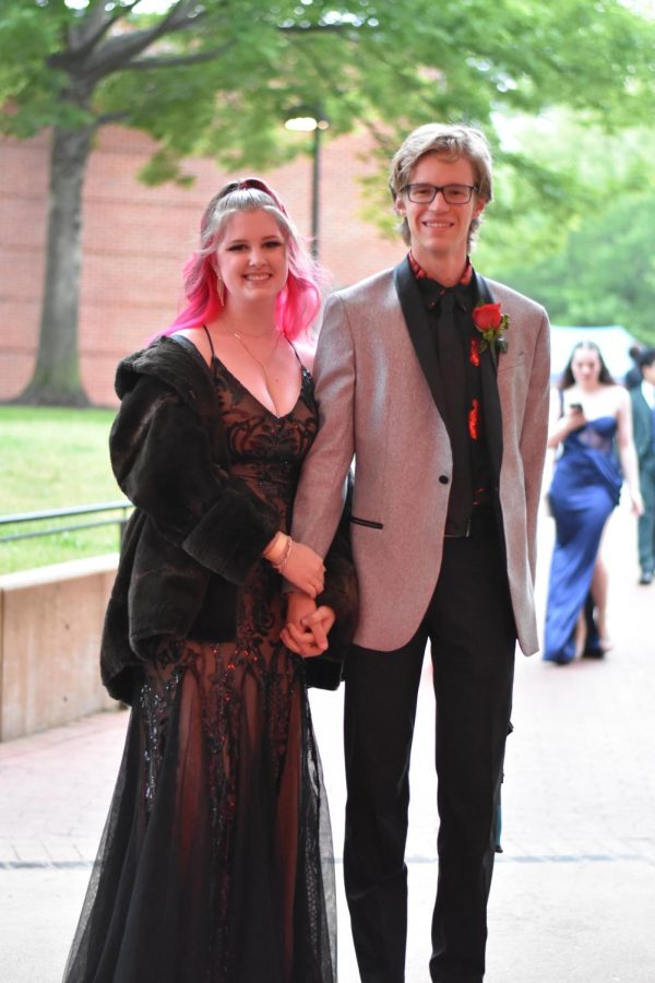 Using her magenta hair highlights as inspiration, seniors Gracie Bitrick and Sid Wiseman coordinated her dress, his jacket and buotonniere to match.