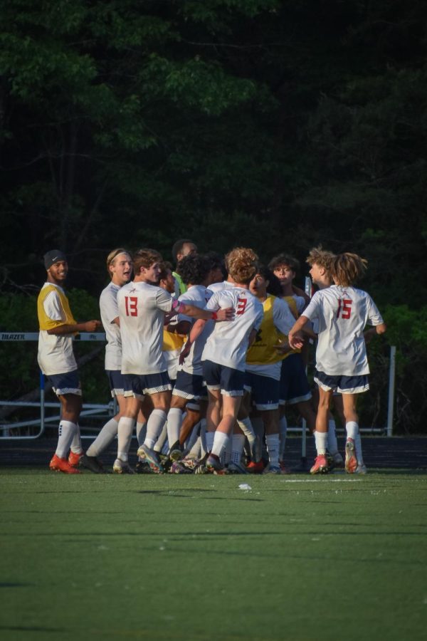 The Patriots celebrate after their game-winning goal against Western, 15 minutes into the first half. The goal was scored by senior captain Maycol Echeverria.