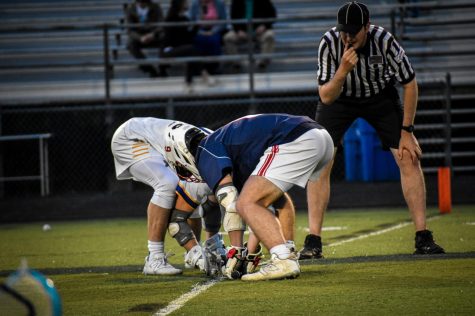 Senior Owen Tighe battles WAHS player for the draw in the second half of the away game against Western. 