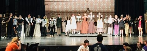 The cast and crew of this years musical, Little Women, gather on stage at the end of their last dress rehearsal. 