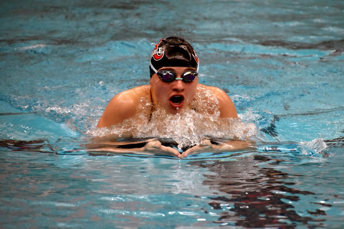 Senior Grey Davis glides through the water during the breaststroke portion of the girls 200 IM at the 2023 Ben Hair Swim Meet. Davis went on to become the state champion in 100 butterfly and backstroke last year.  