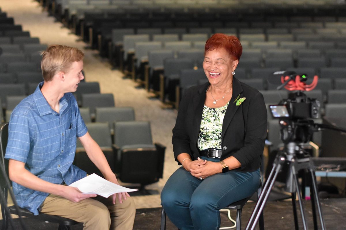 Sophomore Andrew Smith interviews 5th District Congressional candidate Gloria Witt in the auditorium on Oct. 3. Witt sat down with both the broadcast and journalism teams to discuss her views on education and more. 