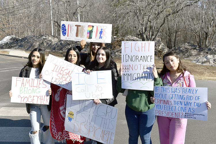 Students gather in the AHS bus lot before leaving campus.