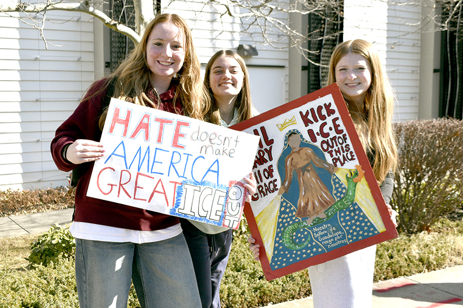 Students display homemade signs protesting the federal agency Immigration and Customs Enforcement, better known as I.C.E.