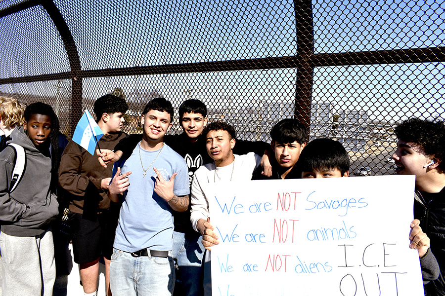 Students pack the newly completed pedestrian bridge over route 29 by Stonefield as part of their protest.