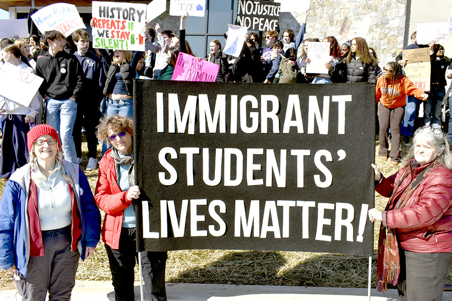 Members of Indivisible, a local progressive organization, join AHS students at Stonefield.
