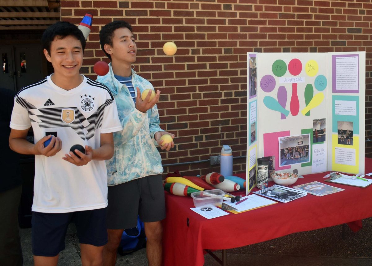 Members of the Catch Me If You Can juggling club perform during the club fair on Aug. 29. Non-curricular clubs could be facing more restrictions on guest speakers, leadership, and finances if the School Board approves new policy changes.  